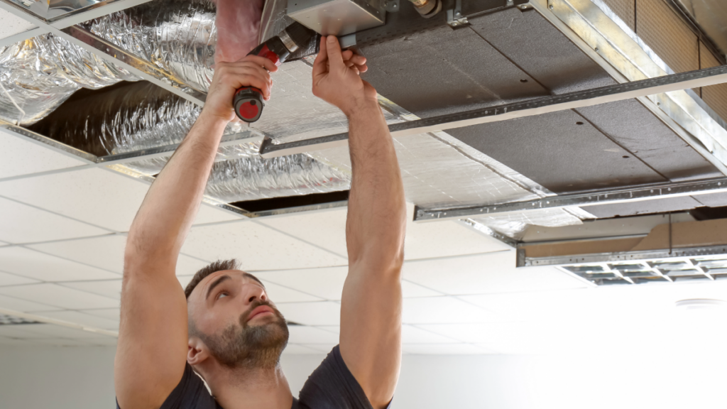 The Role of Ventilation Systems in HVAC Efficiency and Indoor Air Quality 3 an hvac technician performing service on an advanced ventilation system 1024x576 1