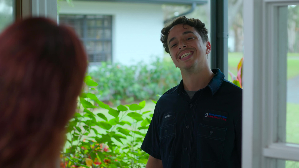 Smart Thermostats 5 Custom air conditioning and air quality technician approaching a residence for service