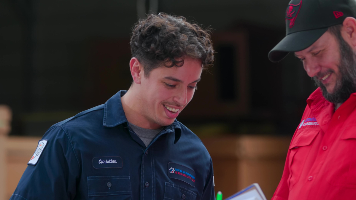 UV Lights 5 Team meeting to evaluate an HVAC system and determine the best repair approach