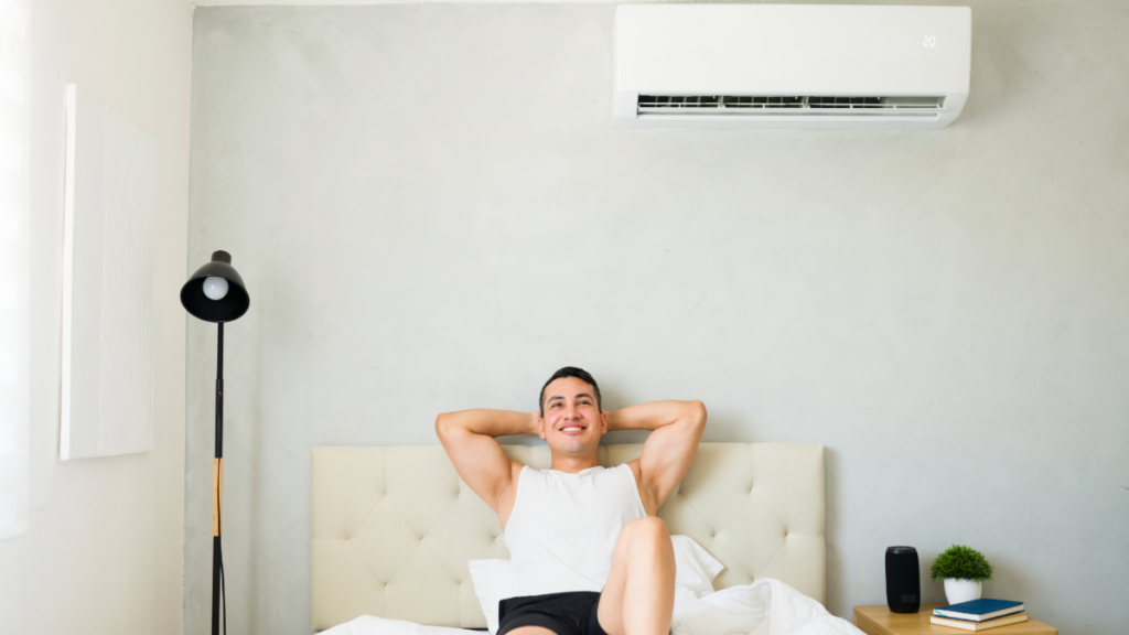 Mini-Split AC Systems: Best Brands, Efficiency, and Choosing the Right One 1 a man enjoying the climate in a room controlled by a ductless mini split ac unit 1024x576 1