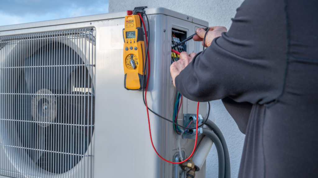 Mini-Split AC Systems: Best Brands, Efficiency, and Choosing the Right One 5 a technician installing a ductless mini split ac unit 1024x576 1