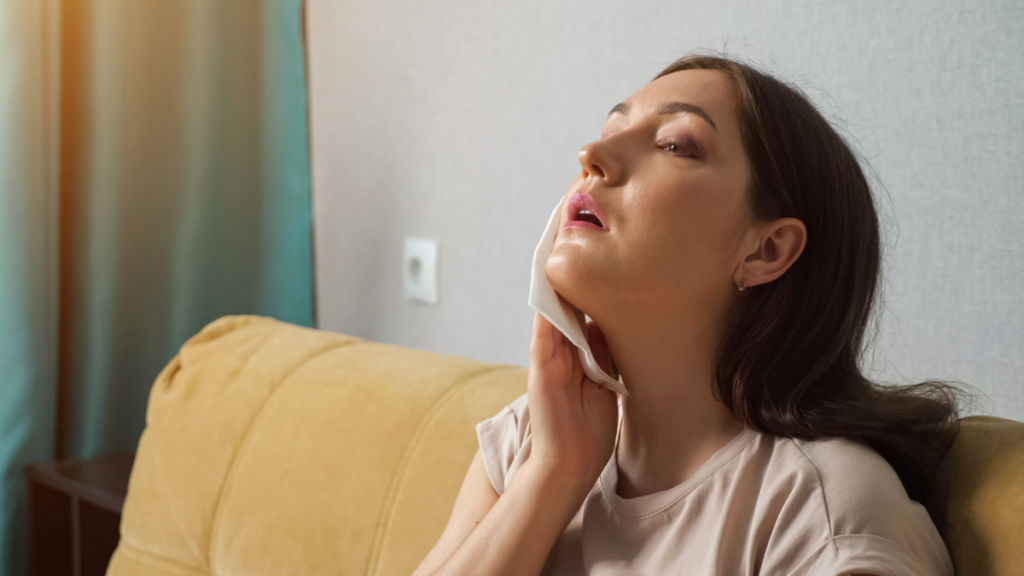 Why HVAC Maintenance Services Are Essential in Pasco County in 2025 3 a woman sweating during a hot tampa summer 1024x576 1