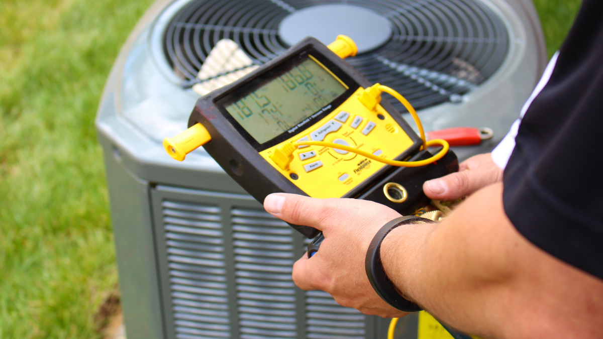 How to Choose the Right AC Installer in Temple Terrace in 2025 2 an hvac technician doing ac repair in temple terrace 1